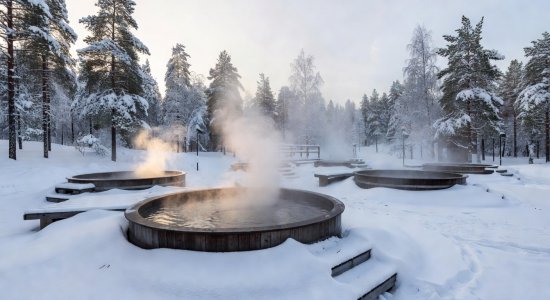 Outdoor thermal hot baths surrounded by snow
